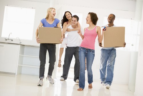 Moving team handling flat removals in Stockwell on a busy residential street