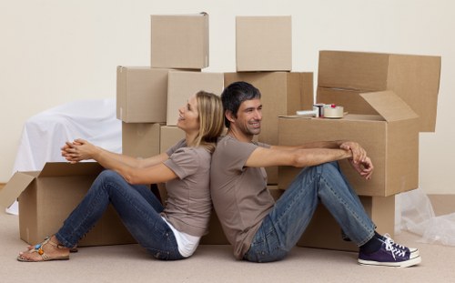 Furniture and boxes being unloaded at a new Stockwell property