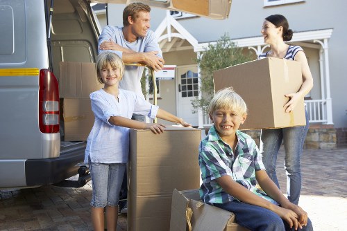 Careful handling of furniture and bags on a narrow stairwell