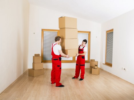 Local moving team navigating Stockwell streets with furniture